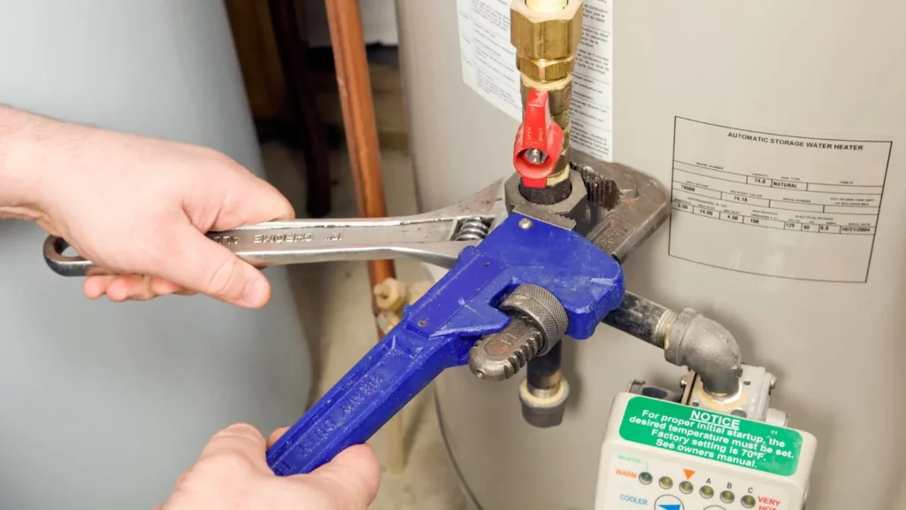 Technician installing a water heater