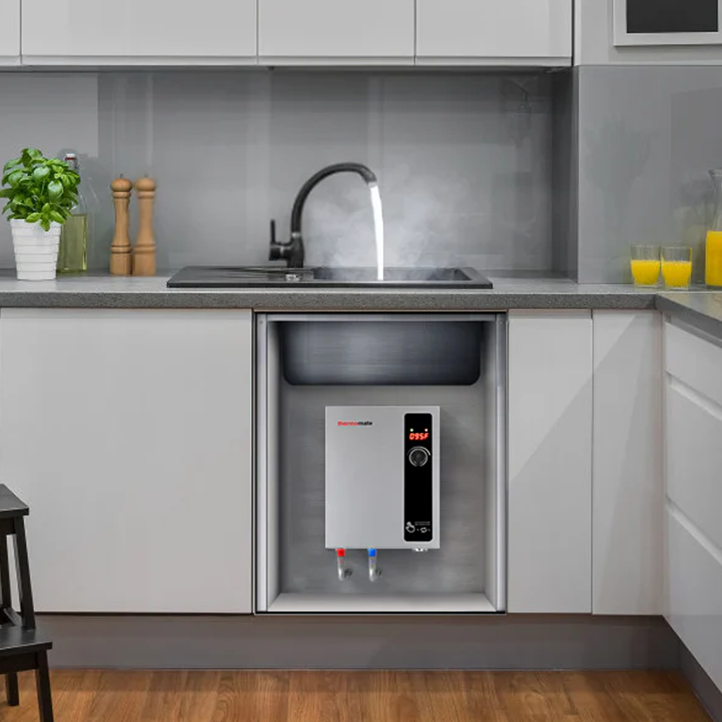 A compact tankless water heater mounted on a wall, showcasing its space-saving design.